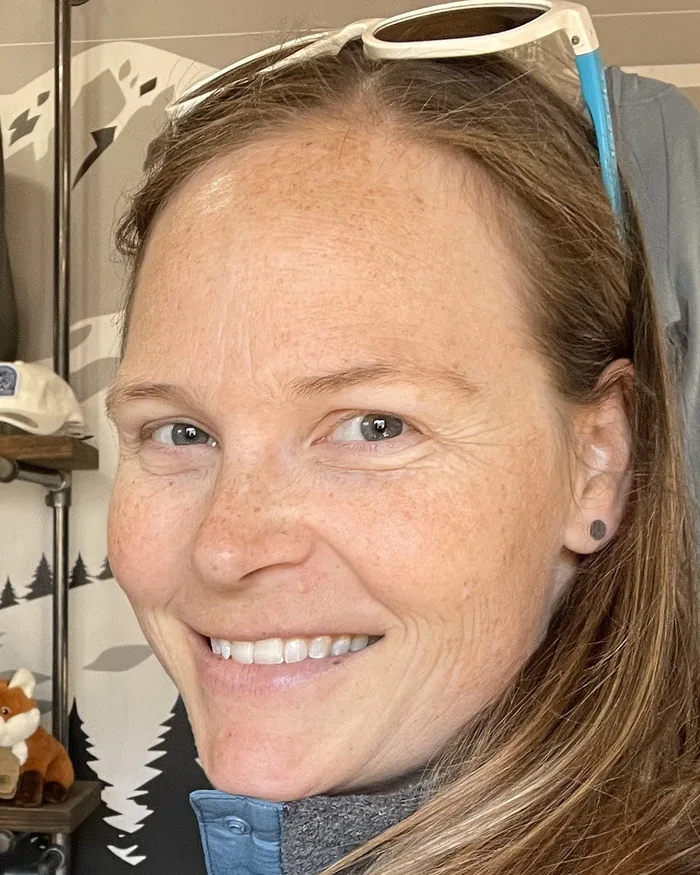 Channing Howard, the owner and artist behind Spotted Fawn Baby Co, smiling